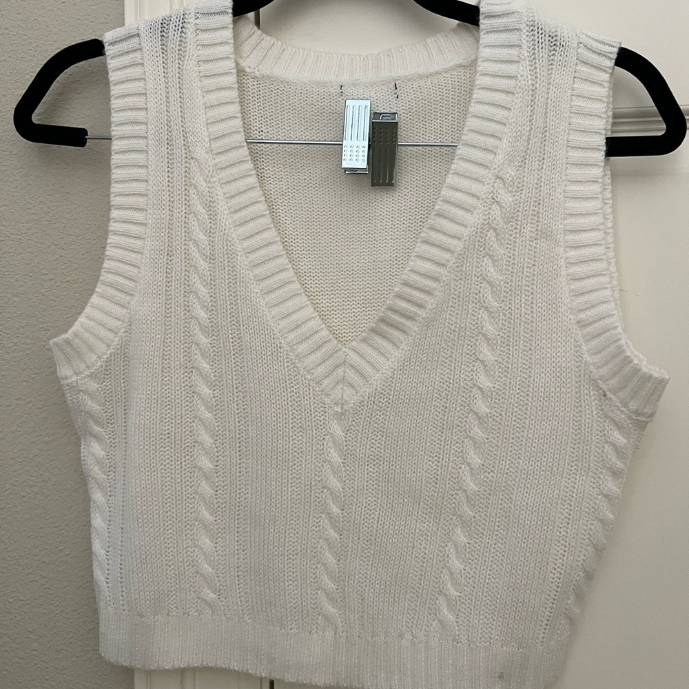 Cream colored ; sweater vest!